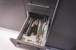 a drawer filled with scissors and other utensils at WowNavigli Apartment-Sofa Bed Metro M4 Tram 2 in Milan