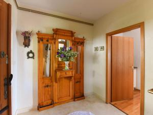 a hallway with a vase of flowers on a cabinet at Holiday Home Andrea by Interhome in Brseč