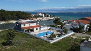 an aerial view of a house with a body of water at Apartment Sana 1 in Vir