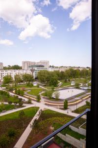 a view of a park from a balcony at Aparthotel Park - By The Sea in Gdynia