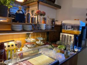 a counter with food on it in a kitchen at Pension U Draka in Karlovy Vary