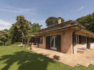 a house with a patio and a yard at Villa Villa Oriental by Interhome in Genazzano