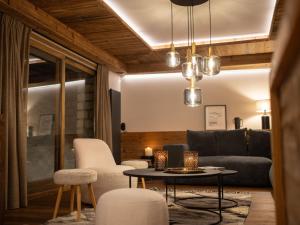 a living room with a couch and a table and chairs at Apartment Le Canvolan-1 by Interhome in Tignes +39 photos