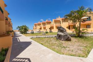 a statue of a bear in front of a building at CT Las Tres Palmeras in Valle Gran Rey
