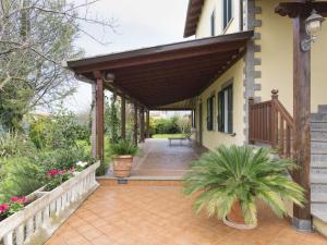 a porch of a house with a wooden awning at Holiday Home Lungo l'Ardeatina by Interhome in Rome