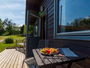 a plate of food on a table on a porch at Chalet Lodge 1 by Interhome in Launceston