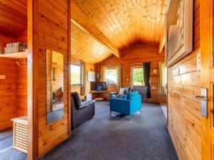 a living room with wooden walls and a wooden ceiling at Chalet Lodge 1 by Interhome in Launceston +40 photos