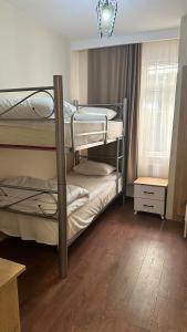 two bunk beds in a room with a window at Albatros Apart Suite in Istanbul