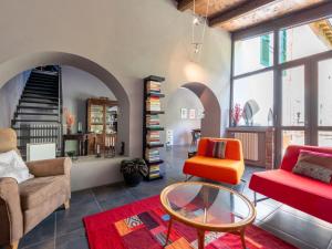 a living room with two chairs and a table at Holiday Home Beppe Country House by Interhome in Serravalle dʼAsti