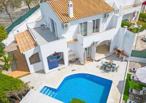 an aerial view of a villa with a swimming pool at Villa Del Sol by Algarve Vacation in Quarteira