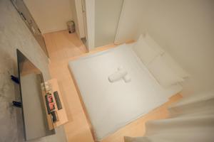 Katil atau katil-katil dalam bilik di Double H Boutique Hotel