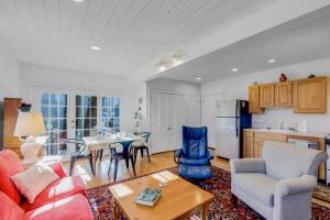 a living room with a couch and a table at Linden Tree Carriage House in Newburyport