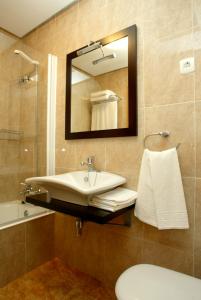 a bathroom with a sink and a mirror at URDINETXE in Luyando