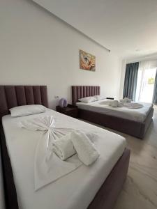 Katil atau katil-katil dalam bilik di Liel Apartments