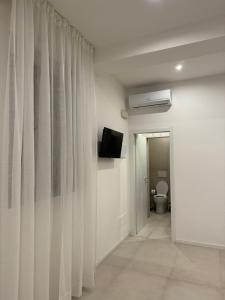 TV a/nebo společenská místnost v ubytování B&B La Coccinella + 29 fotografií