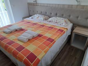 Postel nebo postele na pokoji v ubytování Rooms & Apartment Mama Mia