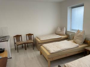 מיטה או מיטות בחדר ב-Zimmer in Rom