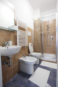 a bathroom with a sink and a toilet and a shower at Jungle Rooms in Cetara +33 photos