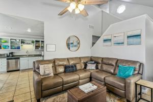 a living room with a couch and a kitchen at 3192 Birdseye Cir in Gulf Breeze