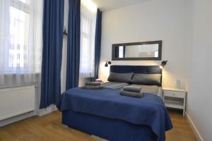 Posteľ alebo postele v izbe v ubytovaní Apartament Turkusowy- Centrum Gliwic