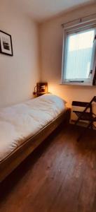 En eller flere senge i et værelse på Amelanderkaap 31 met zwembad + 10 billeder