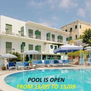 a pool is open from to in front of a hotel at Casa Colomba in Anacapri