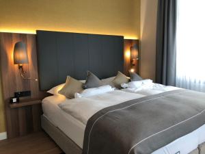 Postel nebo postele na pokoji v ubytování Boutique-Hotel Moseltor