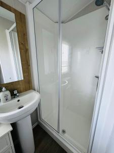 a bathroom with a shower and a sink at Tigh na Mara in Padstow +18 photos