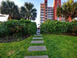 a stepping stone path through a lawn in a city at Super Cute With Deeded Beach Access (#26) - Sleeps 5 in Gulf Shores