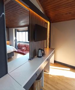 a room with a counter with a tv on it at Bonita Boutique in Istanbul