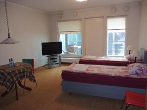 Giường trong phòng chung tại Estinn Apartment