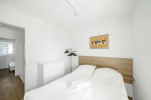 Ένα ή περισσότερα κρεβάτια σε δωμάτιο στο Modern 2-BR apartment in Ørestaden - 355 +2 φωτογραφίες
