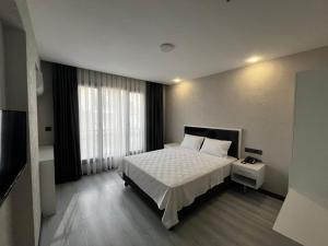 Postel nebo postele na pokoji v ubytování Beyoğlu Palas Otel