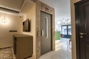 a hallway with a door leading into a room at Classio Hotel Kadıköy in Istanbul