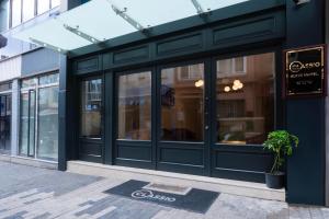 a store front with glass doors on a street at Classio Hotel Kadıköy in Istanbul