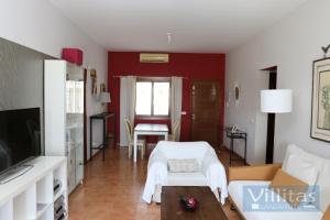 a living room with red walls and a white couch at VILLAZUL by Villitas in Playa Blanca