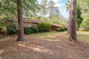 a house with two trees in front of it at 5 mins to Fort Jackson - The Wooded Hilltop Ranch in Columbia