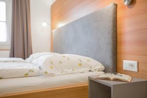 Postel nebo postele na pokoji v ubytování Residence krUma