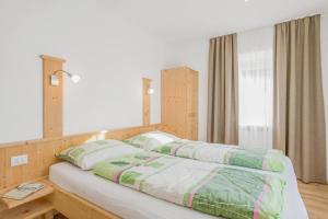 Postel nebo postele na pokoji v ubytování Residence krUma
