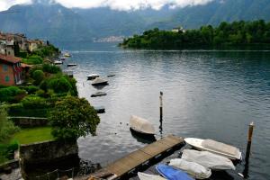 a group of boats are docked on a lake at Appartamento Gold Menaggio in Menaggio