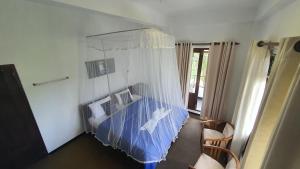 Postel nebo postele na pokoji v ubytování Villa Emerald Ella