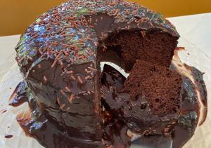a chocolate cake with chocolate frosting and sprinkles at Pousada Alto da Praia in Arraial d'Ajuda