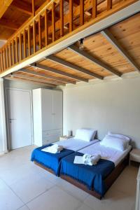 Posteľ alebo postele v izbe v ubytovaní Green 'n Gray Sea & Mountain House