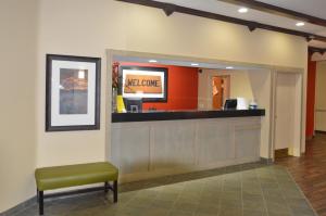 a waiting room with a waiting counter and a green chair at Extended Stay America Suites - Anchorage - Downtown in Anchorage