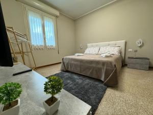 Casa Ponte Romano tesisinde bir odada yatak veya yataklar