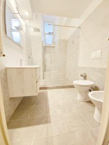 a bathroom with a sink and a toilet and a shower at Like at Home Trastevere in Rome +16 photos