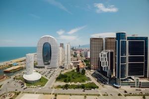 uma vista aérea de uma cidade com edifícios altos em Hotel in Orbi City Official em Batumi