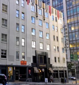 a large building on a city street with at EMBASSY HOTEL in San Francisco