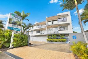 a large building with a sign on the side of it at Beachside Mooloolaba in Mooloolaba