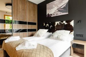 Posteľ alebo postele v izbe v ubytovaní Apartamenty Pod Giewontem Lux&Spa Zakopane
